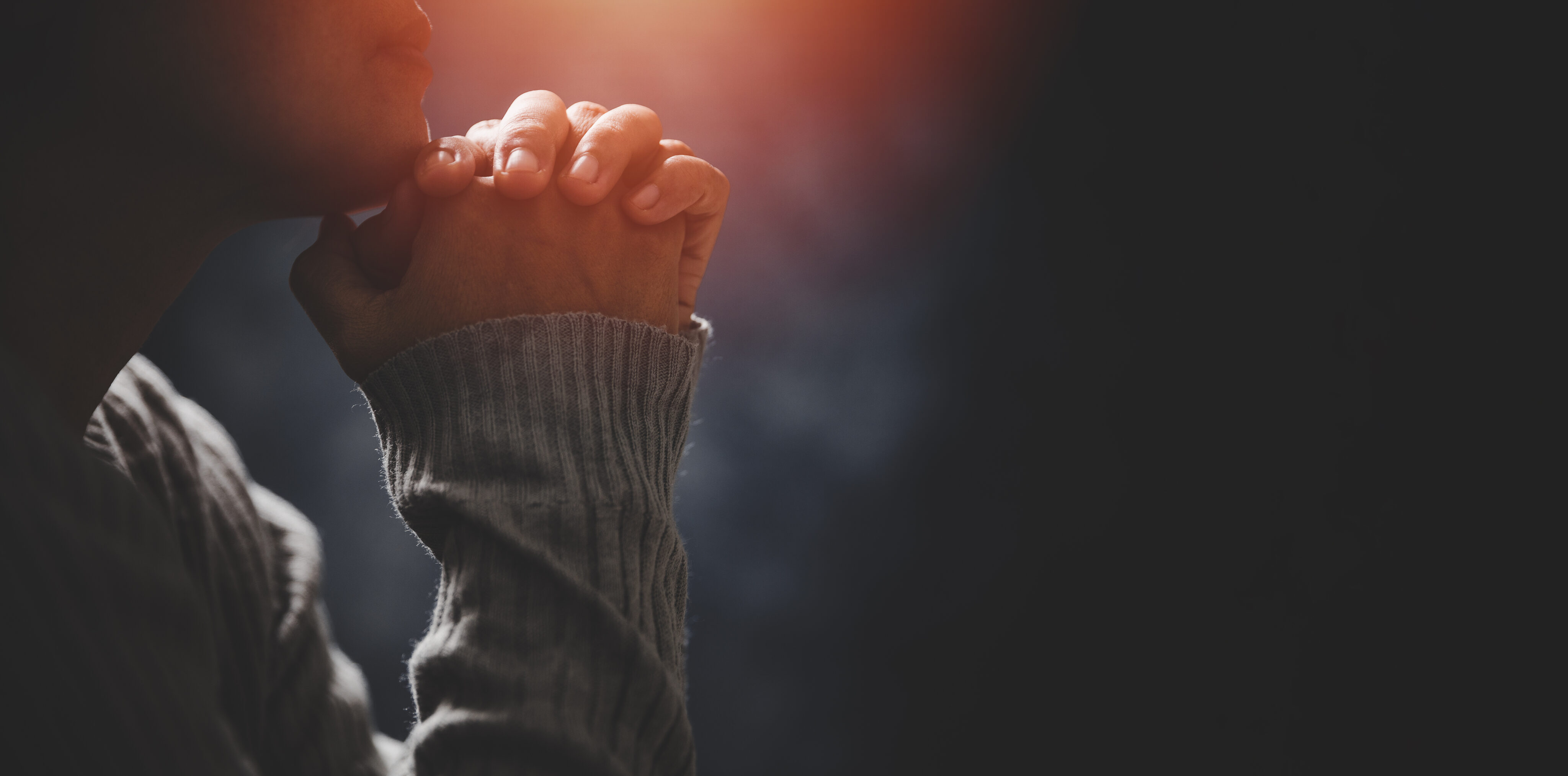 Christ religion and christianity worship or pray concept. Christian catholic woman are praying to god in dark at church. Prayer person hand in black background. Girl believe and faith in jesus christ. Christ religion and christianity worship or pray concept. Christian catholic woman are praying to god in dark at church. Prayer person hand in black background. Girl believe and faith in jesus christ.